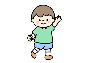 片手を上げる男の子